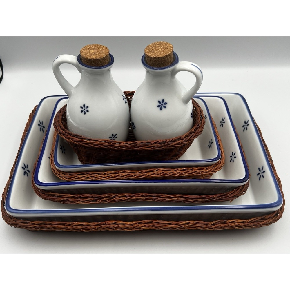 Vintage ceramic bakeware accompanying wicker baskets, and cork-stoppered cruets